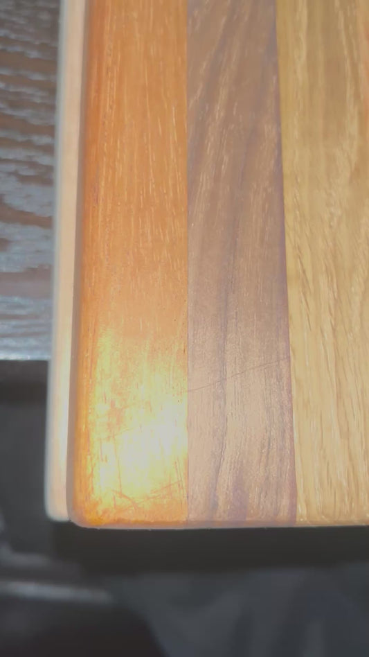 High Quality- Handcrafted “7 Woods” Cutting Board (15in x 11in)